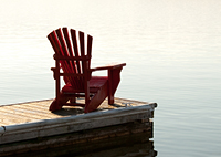 Adirondack Chair at sunset on s dock.