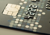 Image of credit card, close up on chip and first 4 numbers