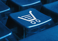 Shot of keyboard with a shopping cart on it