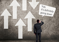 Image of guy staring at wall of up and down arrows saying Yup, it's definitely going down