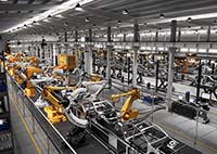Car plant conveyor line with machines runnning the coveyor line