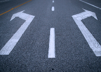 Image of a 2 lane road with arrows going left and right