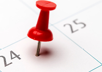 Image of thumb tack in calendar